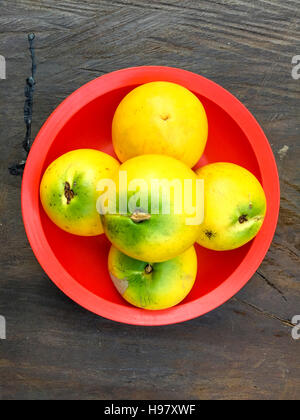 Fresh Abiu or Pouteria caimito fruits on the top of the wooden table with natural light. Stock Photo