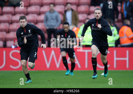 Liverpool's James Milner (left) and Liverpool's Jordan Henderson (right) warm up prior to kick off during the Premier League match at St Mary's Stadium, Southampton. Stock Photo