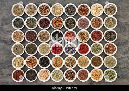 Large herb tea sampler in white china bowls. Teas also used in natural alternative medicine. Stock Photo