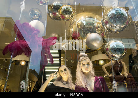 Mirrored glitter Balls, and mannequins in Christmas shop window in Liverpool city centre, Merseyside, UK Stock Photo