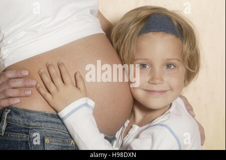 Pregnant mother and her daughter Stock Photo