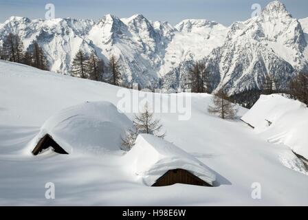 Alpine hut covered with snow, in the back the Totes Gebirge Range, Hinterstoder, Upper Austria Stock Photo