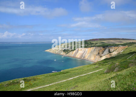 Alum Bay with it's multi-coloured sand cliffs seen from the Needles Headland. Stock Photo