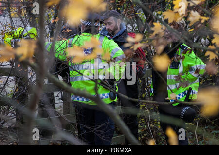 Heathrow, UK. 19th November, 2016. A protester against airport expansion is detained by police. The protest was organised by 'Rising Up!', a new network focused on pressurising the Government to take seriously the threat of climate change and to rapidly reduce carbon emissions. Credit:  Mark Kerrison/Alamy Live News Stock Photo