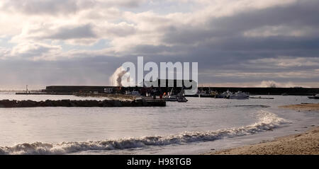 Lyme Regis Dorset, UK. 20th Nov, 2016. Waves break over The Cobb wall in Lyme Regis after the storms of last night along the south coast had blown through this morning Credit:  Simon Dack/Alamy Live News Stock Photo