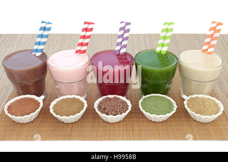 Health food drinks with powders of chocolate maca, pomegranate fruit, acai berry, wheatgrass and maca root. Also used by body builders. Stock Photo