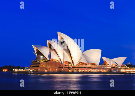 Sydney, Australia - 15 November 2016: Iconic worlds' buildings - Sydney Opera house in full glory at sunset brightly illuminated Stock Photo