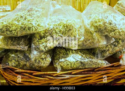 bags with dried oregano on sale in the stall Southern Italy Stock Photo