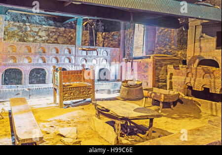 The medieval interior of traditional Svan house with carved wooden furniture, decorated with geometric patterns Stock Photo