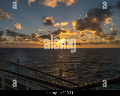 A sunrise over the sea from Royal Caribbean's Harmony of the Seas cruise ship in the mid-Atlantic Stock Photo