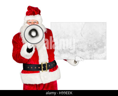 traditional classic red white santa claus making shouting loud announcement with bullhorn megaphone concrete stone billboard in his other hand isolate Stock Photo