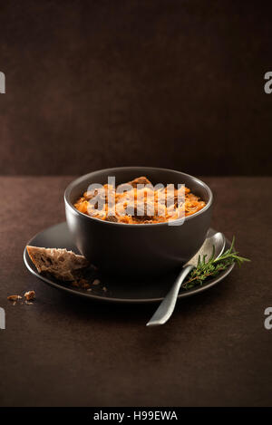Goulash cabbage with beef on dark background. Stock Photo