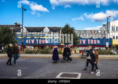 People walk past New York amusement arcade for playing games, pool, slot machines and betting. Southend-on-sea, Essex,England Stock Photo