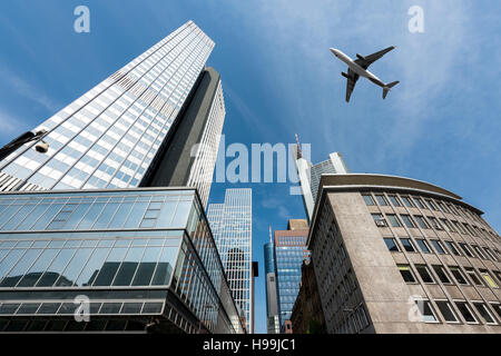 Frankfurt skyscrapers buildings and a plane flying overhead in morning at Frankfurt, Germany. Stock Photo