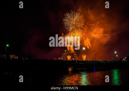 Fourth of July fireworks over the Broad Canal at night, in Cambridge, Massachusetts. Stock Photo