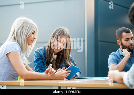 Businesswomen using digital tablet in workshop Stock Photo