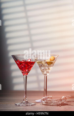 Cocktail splash in martini glass over black background with copy by Jelena  Jovanovic