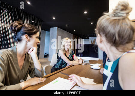 Group of businesswomen having a meeting Stock Photo