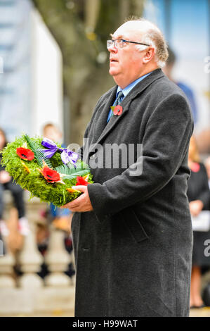 Belfast, Northern Ireland. 13 Nov 2016 - Chairman of Bombardier, Belfast, and Honorary Consul for Canada in Northern Ireland, Kenneth Ken Brundle, lays a wreath from Canada at Remembrance Sunday service. Stock Photo