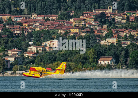 Canadail 415 charge water from Viverone lake in Italy Stock Photo