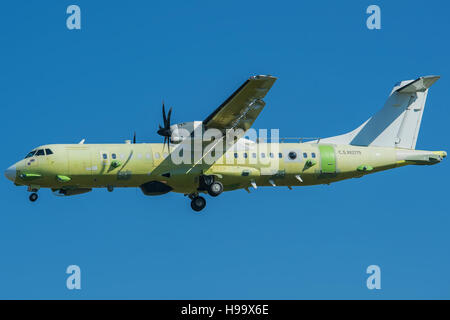 ATR 72 in Primer Livery land on runway 36 of LIMF Turin Airport Stock Photo