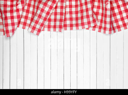 Red tablecloth on wooden table, top view Stock Photo
