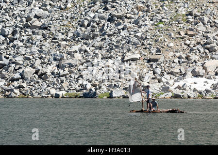 Sailing a jerry-rigged log raft across a lake in Oregon's Wallowa ...