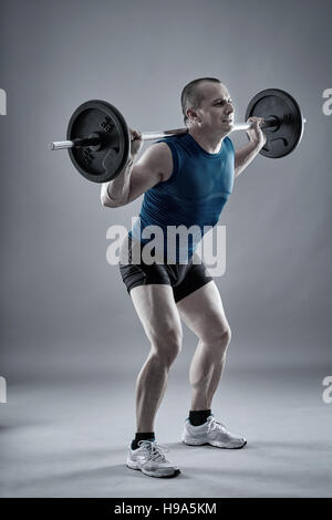 athletic man doing squat and back exercise and cross training with dumbbells  Stock Photo - Alamy