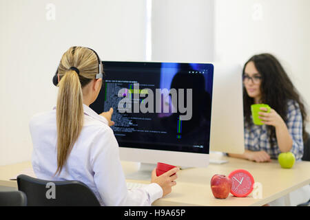 startup business, young woman as software developer working on computer at modern office Stock Photo