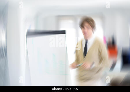 Freelancer looking at his ideas written on paper and stuck to a wall Stock Photo