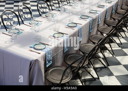 A long table laid out ready for a birthday party at a venue Stock Photo