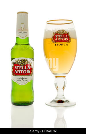 Winneconne, WI - 20 November 2016:  Bottle of Stella artois beer with a chalice full of Stella on an isolated background. Stock Photo