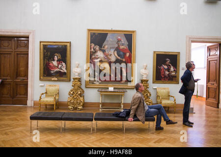 People looking painted art in Capitoline museums hall, Rome, italy,  musei capitolini, art heritage touristic landmark Stock Photo