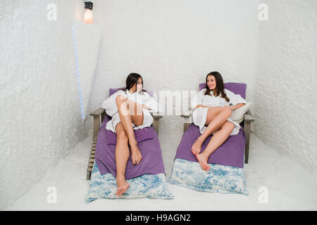 Two women relaxing in a salt cave at Halotherapy Stock Photo