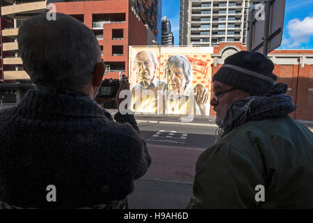 Onlookers photograph a large mural on a wall in Lonsdale Street, Melbourne, Victoria, Australia Stock Photo