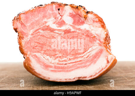 Bacon on a plate isolated on wooden plank Stock Photo