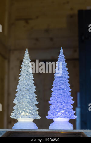 Electric LED novelty mini Christmas xmas tree decoration / lamps / trinkets in pale green and blue purple Stock Photo