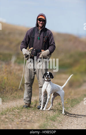 A hunter with an English Pointer Stock Photo