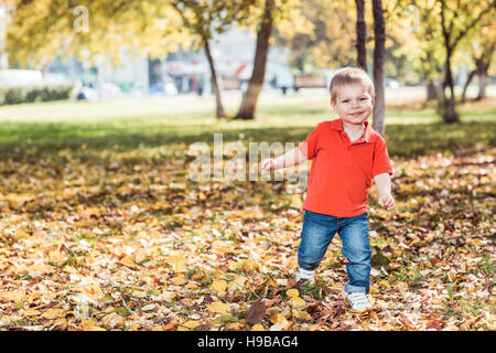 Pretty baby boy running Stock Photo