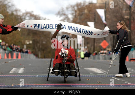 Philadelphia, Pennsylvania, USA. 20th Nov, 2016. Competitors in the wheelchair and hand bike competition cross the finish line of the 2016 Philadelphia Marathon, in Center City, Philadelphia, PA.  With the city of Philadelphia taking over organization the course, as well as start and finish locations are slightly different from past years. The winners for 2016 are, in the Mens race, Kimutai Cheruiyot in 2:15:53, and Taylor Ward in the Womens race in 2:36:25 Credit:  Bastiaan Slabbers/Alamy Live News Stock Photo