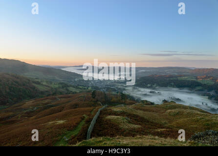 Early morning Autumn mist over Ambleside and Windermere in The English Lake District National Park. Stock Photo