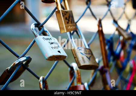 'Pickle and sausage forever' love padlock on a wire fence outside Shoreditch High Street train station Stock Photo