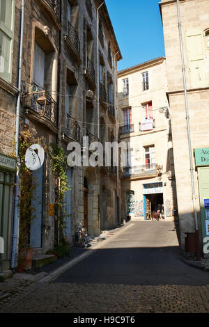 A street scene in the old town centre of Pézenas, France Stock Photo