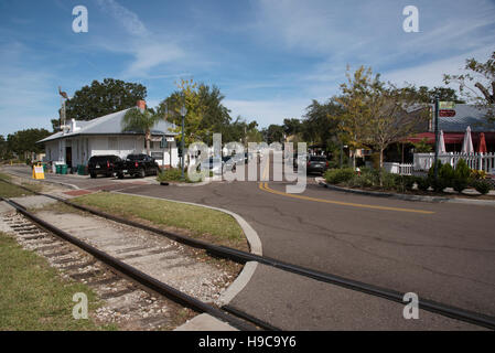 Mount Dora Florida USA - Railroad tracks and the old station looking towards the town center of this small American town Stock Photo