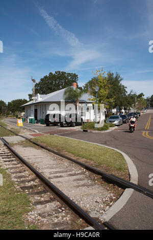 Mount Dora Florida USA - Railroad tracks and the old station looking towards the town center of this small American town Stock Photo