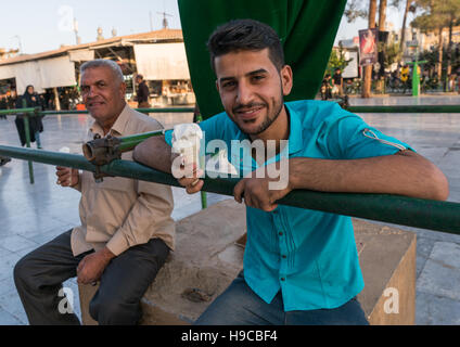 Iraqi pilgrims in fatima al-masumeh shrine esplanade, Central county, Qom, Iran Stock Photo