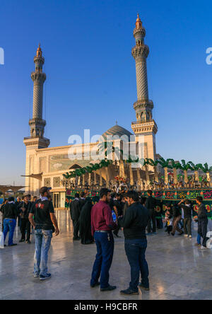 Alam procession during muharram celebrations in fatima al-masumeh shrine, Central county, Qom, Iran Stock Photo