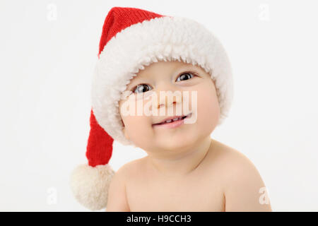 Smiling boy in Santa's hat. Baby santa Stock Photo