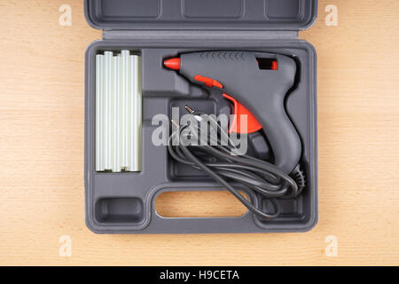 hot glue gun in tool case Stock Photo