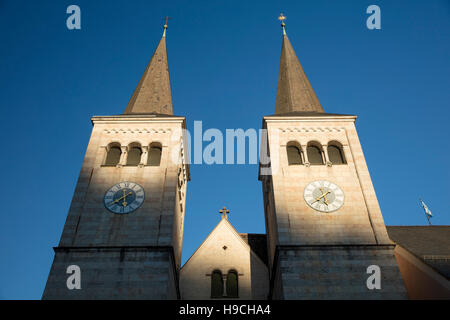 Clock towers of Collegiate Church of St. Peter and John the Baptist (12th c.), Berchtesgaden, Bavaria, Germany Stock Photo